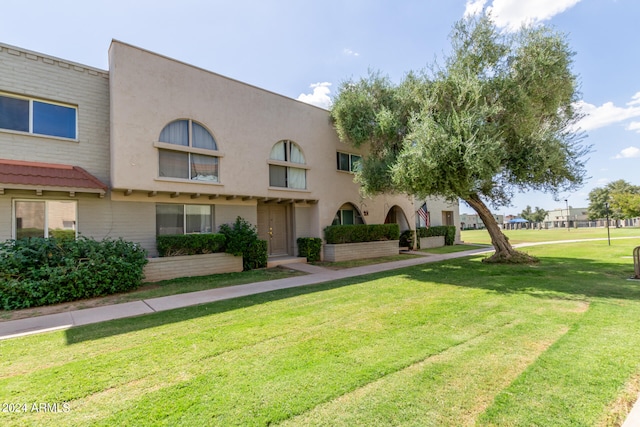 exterior space with a front lawn