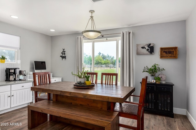 dining area with recessed lighting, wood finished floors, and baseboards