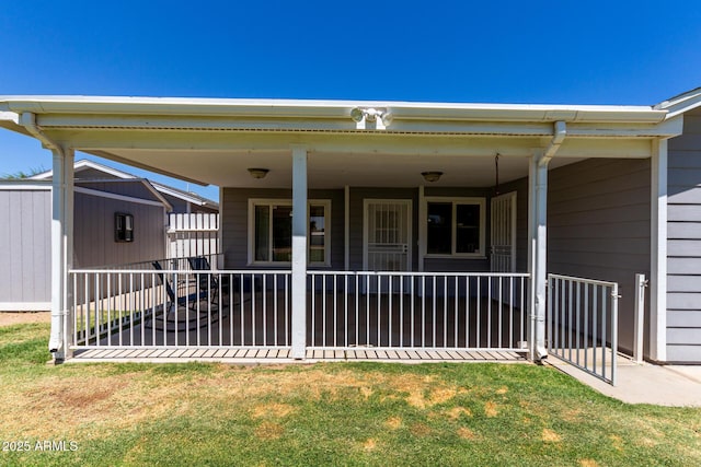 back of property featuring a yard