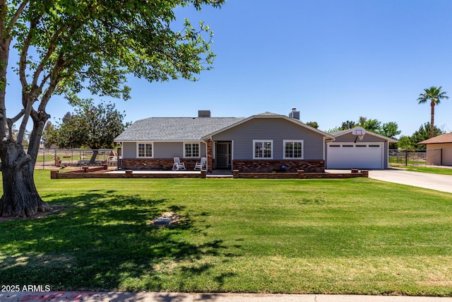 single story home with fence, a front lawn, brick siding, and concrete driveway