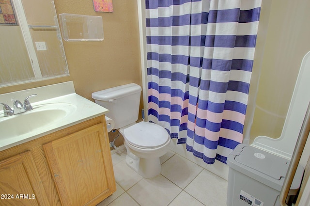 bathroom featuring vanity, toilet, and tile patterned floors