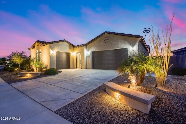 mediterranean / spanish-style house featuring a garage