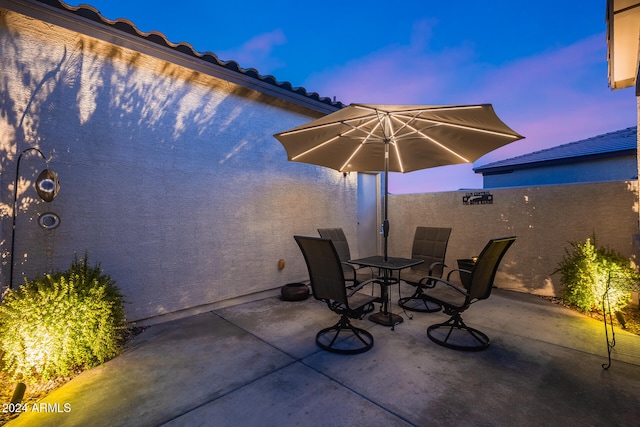 view of patio terrace at dusk