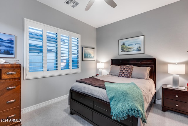 bedroom featuring ceiling fan and light carpet