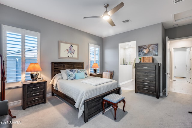 bedroom with light carpet and ceiling fan