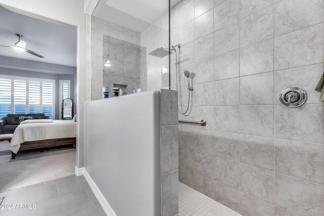 bathroom with tile patterned floors, ceiling fan, and tiled shower