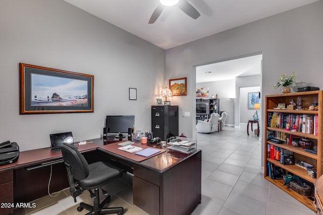 office area with ceiling fan and light tile patterned flooring