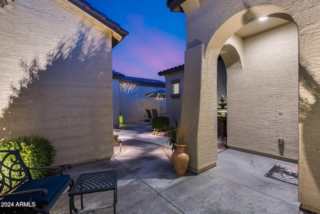 view of patio terrace at dusk