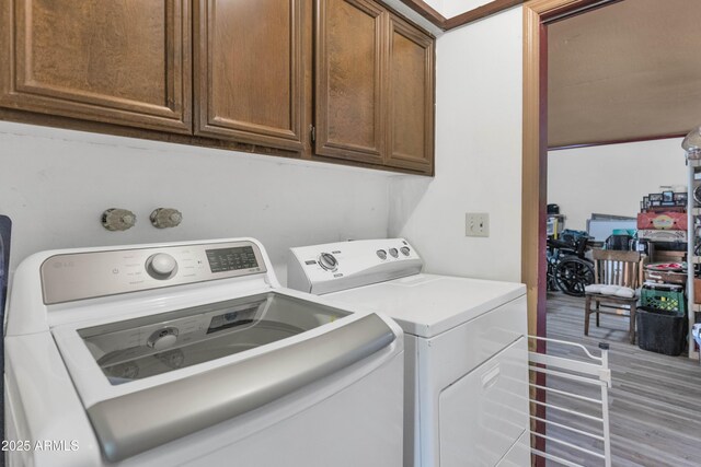 1298 E Buffalo St, Chandler, AZ 85225 - laundry area featuring washer and dryer, cabinet space, and light wood-style flooring