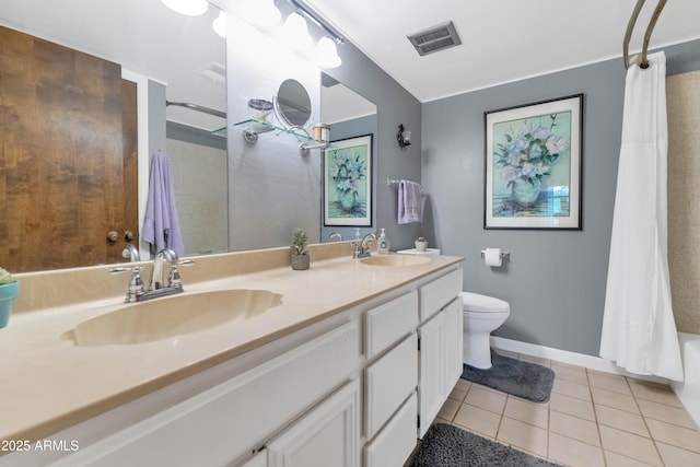 1298 E Buffalo St, Chandler, AZ 85225 - full bathroom with double vanity, tile patterned flooring, toilet, baseboards, and shower / tub combo
