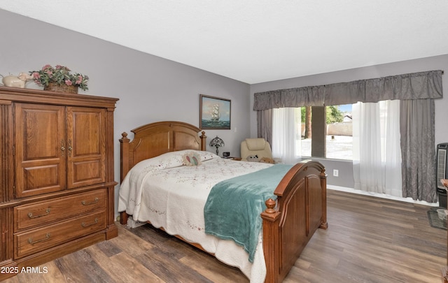 1298 E Buffalo St, Chandler, AZ 85225 - bedroom with wood finished floors and baseboards