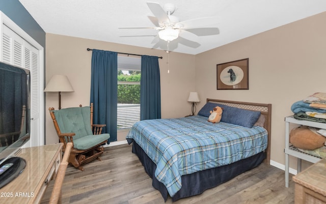 1298 E Buffalo St, Chandler, AZ 85225 - bedroom featuring wood finished floors, a closet, baseboards, and a ceiling fan