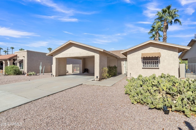 ranch-style house with a carport