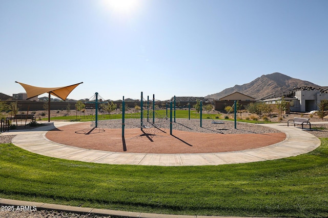 view of community with fence, a mountain view, a pergola, and a yard