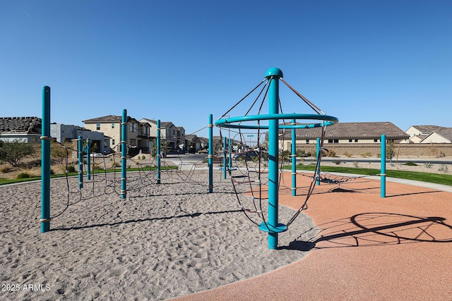 communal playground featuring a residential view