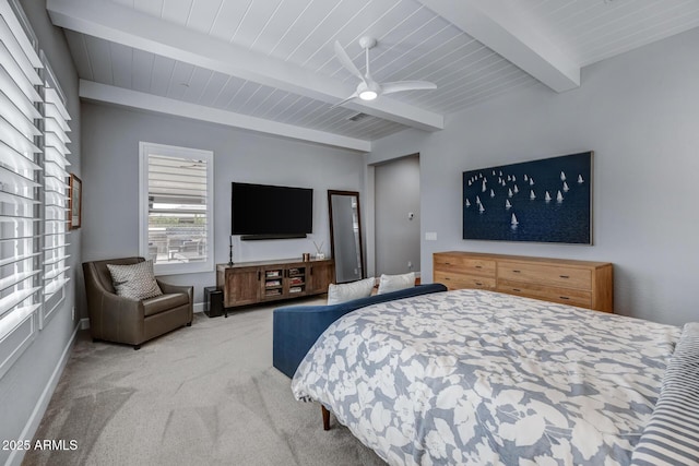 bedroom featuring beamed ceiling, light colored carpet, and wood ceiling