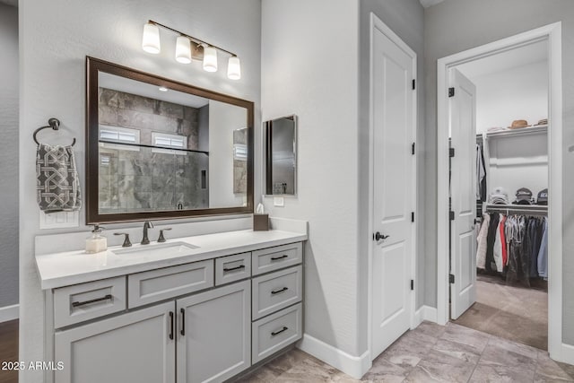 bathroom with vanity and a shower with shower door