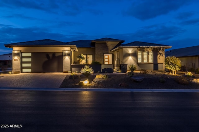 prairie-style home featuring a garage