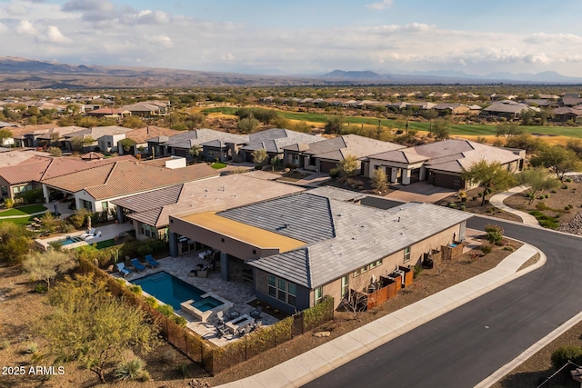 birds eye view of property featuring a mountain view