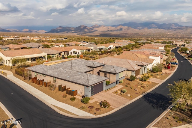 birds eye view of property featuring a mountain view