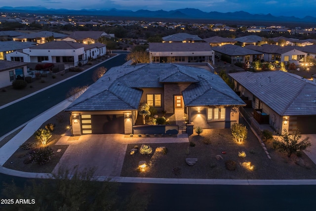 view of front of home featuring a mountain view and a garage