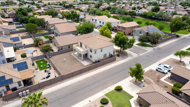 birds eye view of property with a residential view