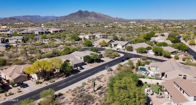 drone / aerial view featuring a residential view and a mountain view