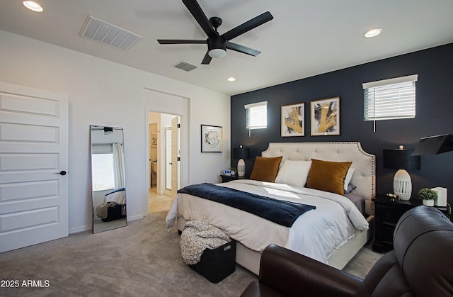 bedroom featuring light carpet, ceiling fan, visible vents, and recessed lighting