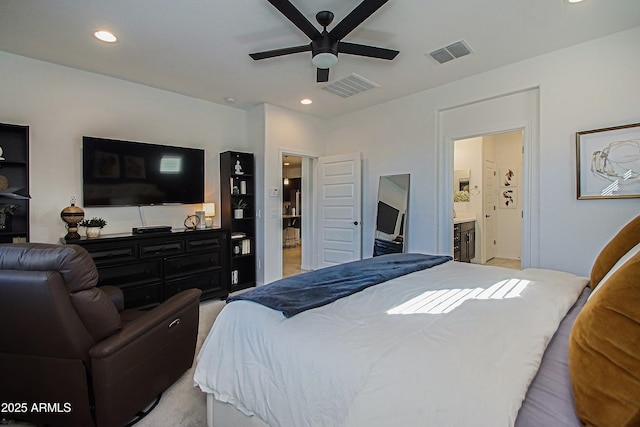 bedroom with ensuite bath, visible vents, and recessed lighting