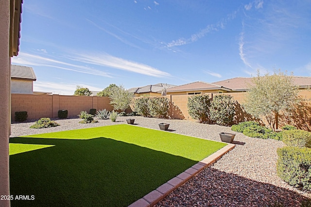 view of yard with a fenced backyard