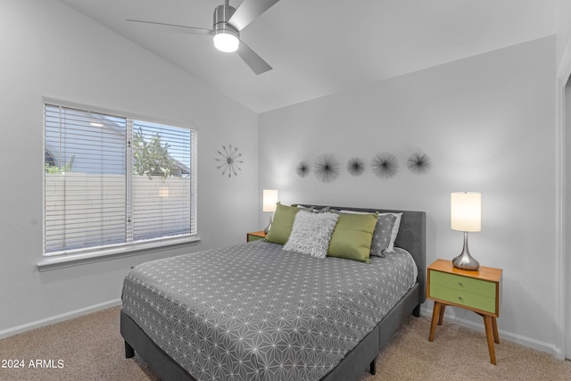 carpeted bedroom featuring lofted ceiling and ceiling fan