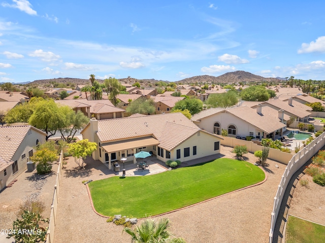 birds eye view of property featuring a mountain view