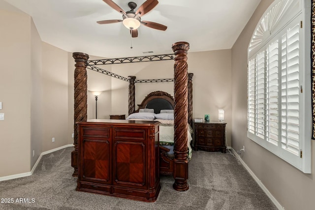 carpeted bedroom with visible vents, baseboards, and a ceiling fan