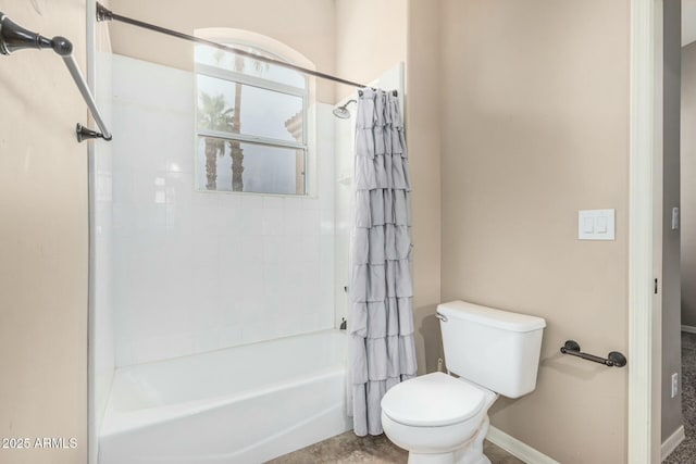 full bath with toilet, shower / tub combo, and baseboards