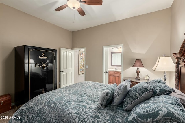 bedroom featuring carpet floors, ceiling fan, and ensuite bath