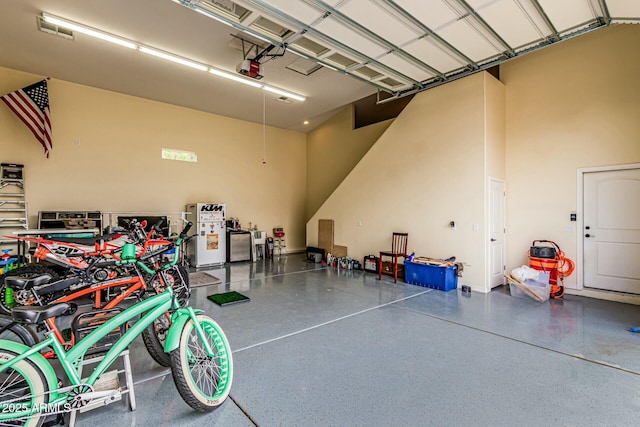 garage featuring visible vents and a garage door opener