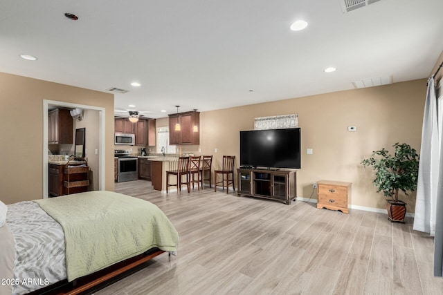 bedroom with recessed lighting, baseboards, visible vents, and light wood finished floors