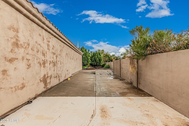 view of home's exterior featuring a patio area, fence, and stucco siding