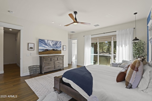 bedroom featuring baseboards, visible vents, ceiling fan, wood finished floors, and access to exterior