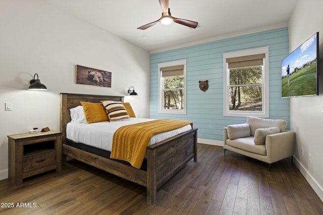 bedroom featuring a ceiling fan, multiple windows, baseboards, and dark wood-style flooring