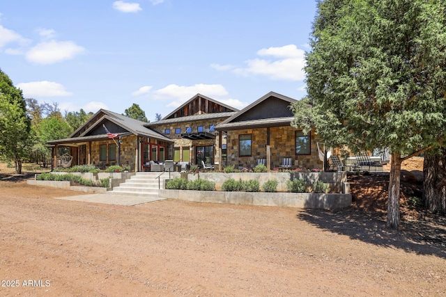 view of front of house with stone siding