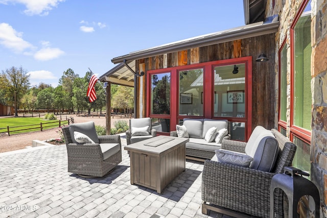 view of patio with fence and an outdoor hangout area