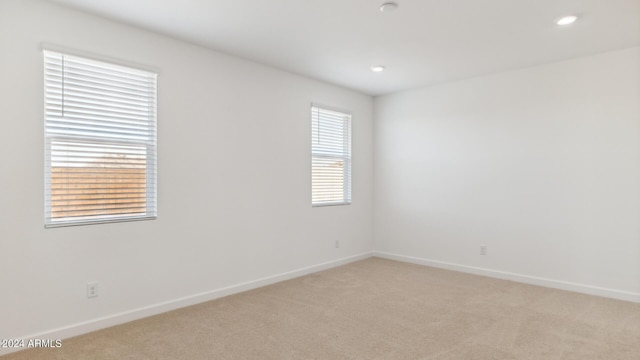 7384 W Buckhorn Trl, Peoria, AZ 85383 - unfurnished room with light colored carpet, baseboards, and recessed lighting