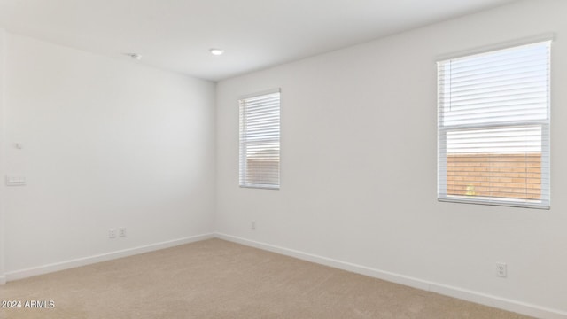 7384 W Buckhorn Trl, Peoria, AZ 85383 - empty room featuring light colored carpet and baseboards