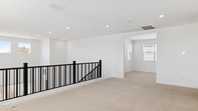 7384 W Buckhorn Trl, Peoria, AZ 85383 - empty room with light colored carpet, recessed lighting, and baseboards
