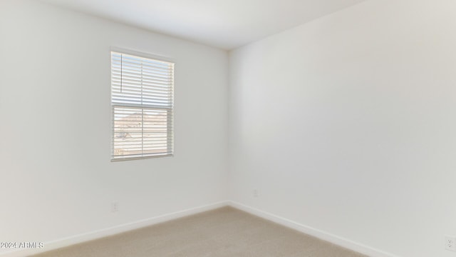 7384 W Buckhorn Trl, Peoria, AZ 85383 - unfurnished room featuring baseboards and light carpet