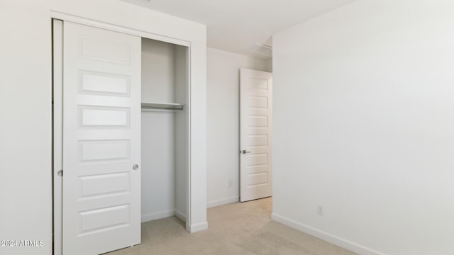7384 W Buckhorn Trl, Peoria, AZ 85383 - unfurnished bedroom with light carpet, a closet, and baseboards