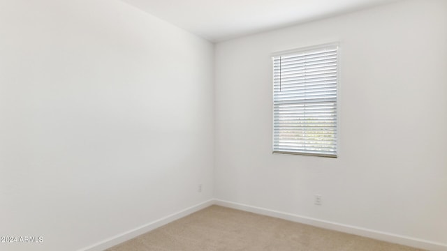 7384 W Buckhorn Trl, Peoria, AZ 85383 - unfurnished room featuring light colored carpet and baseboards
