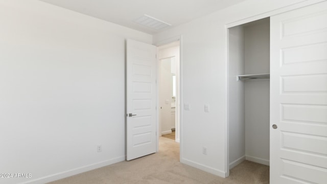 7384 W Buckhorn Trl, Peoria, AZ 85383 - unfurnished bedroom featuring light colored carpet, a closet, and baseboards