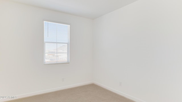 7384 W Buckhorn Trl, Peoria, AZ 85383 - unfurnished room with baseboards and light colored carpet